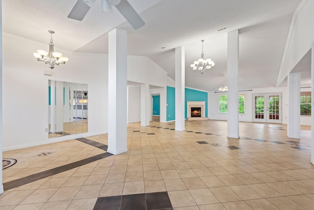 unfurnished living room featuring crown molding, a textured ceiling, ceiling fan with notable chandelier, high vaulted ceiling, and light tile floors