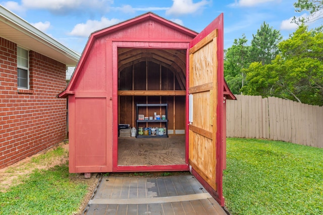 view of shed / structure with a yard