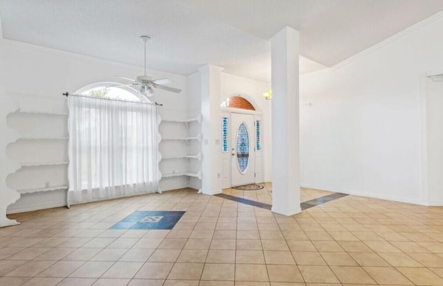 9720 Parker Lake Cir, Navarre, FL 32566 - entryway with crown molding, light tile patterned floors, baseboards, and a ceiling fan