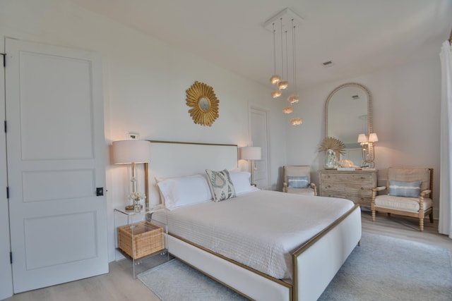 bedroom featuring light hardwood / wood-style floors