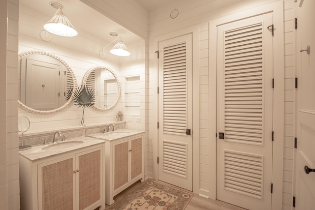 bathroom with vanity and hardwood / wood-style floors