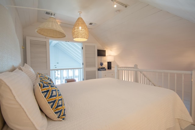 bedroom featuring vaulted ceiling