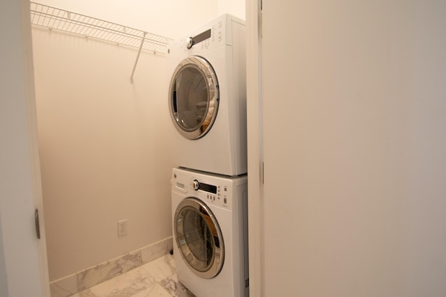 laundry area with stacked washer and dryer