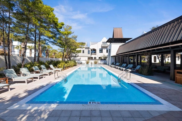 view of swimming pool featuring a patio area