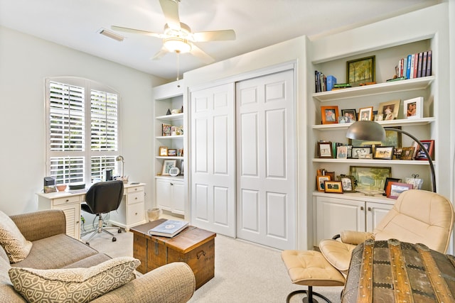 carpeted office featuring ceiling fan