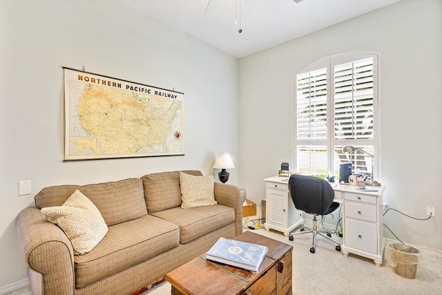 office space featuring plenty of natural light and light colored carpet