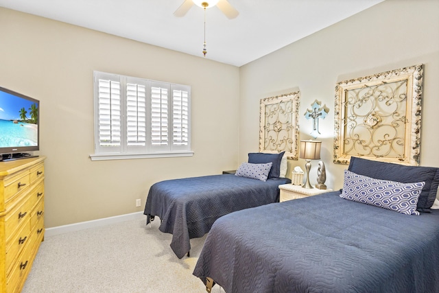 bedroom featuring ceiling fan and light colored carpet