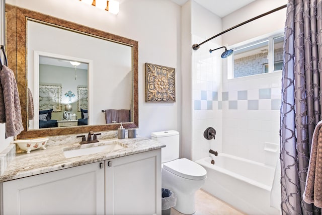 full bathroom featuring tile patterned floors, vanity, toilet, and shower / bath combo with shower curtain