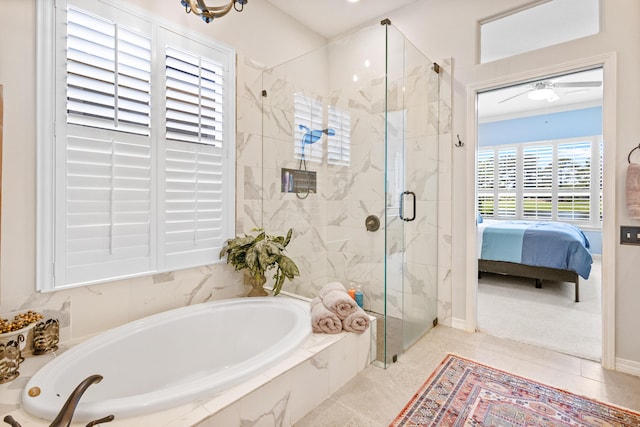 bathroom featuring shower with separate bathtub and ceiling fan