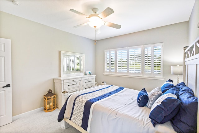 bedroom with light carpet and ceiling fan