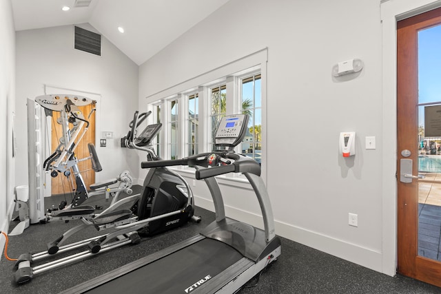 workout room featuring lofted ceiling