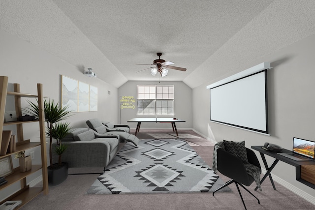 home office featuring a textured ceiling, light colored carpet, ceiling fan, and lofted ceiling