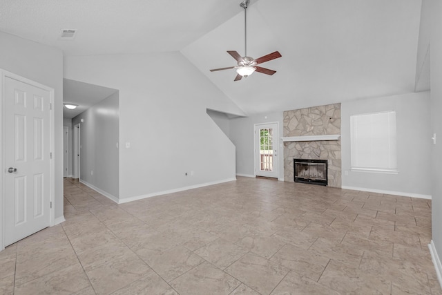 unfurnished living room with ceiling fan, a fireplace, and high vaulted ceiling