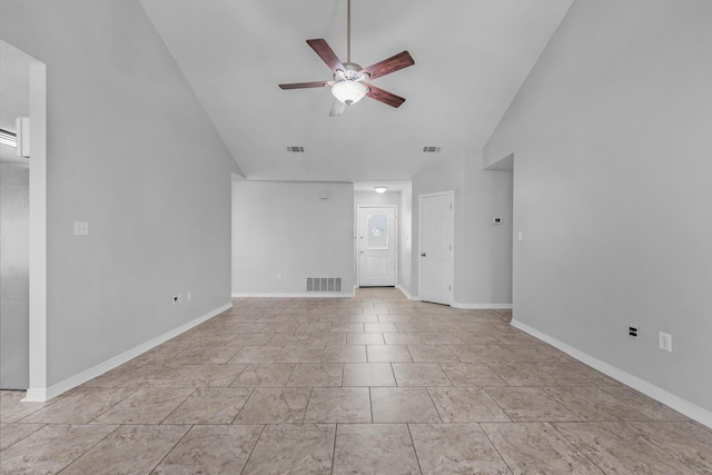 unfurnished living room with ceiling fan and vaulted ceiling