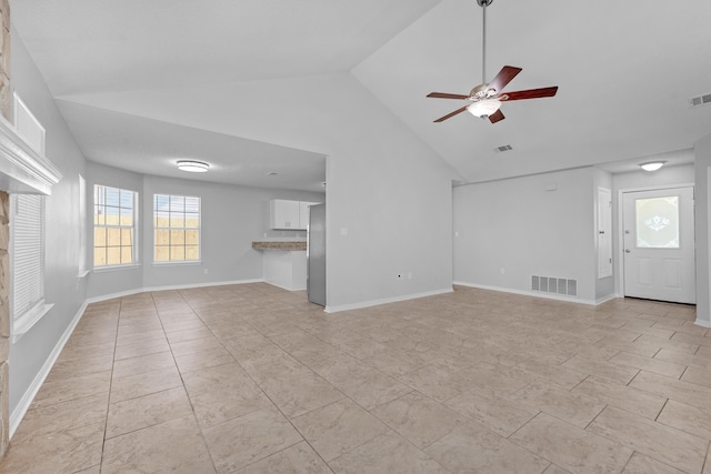 unfurnished living room with high vaulted ceiling, ceiling fan, and light tile patterned flooring