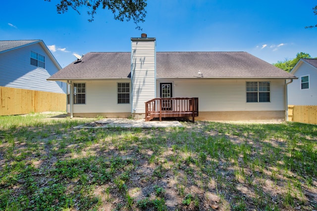 rear view of house with a lawn