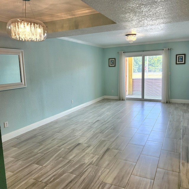 empty room featuring crown molding and a notable chandelier