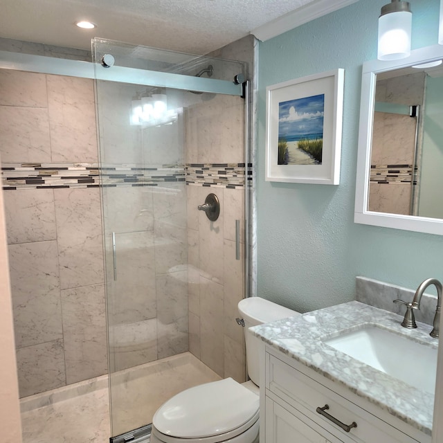 bathroom with vanity, an enclosed shower, and toilet