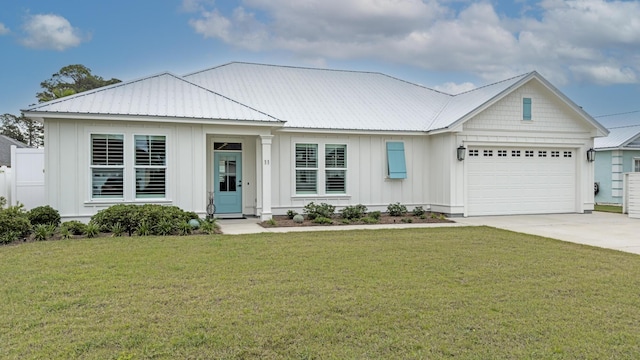 view of front of house with a garage and a front lawn