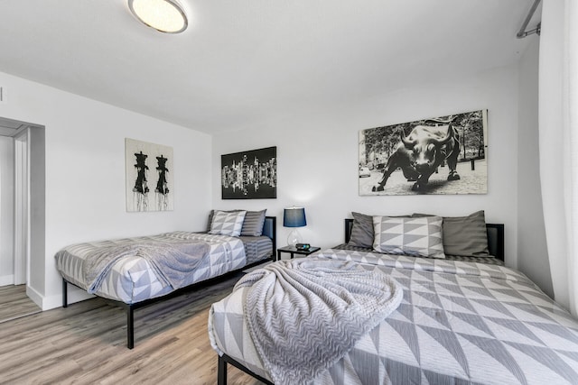 bedroom with light wood-style flooring