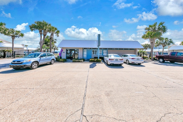 view of property with uncovered parking