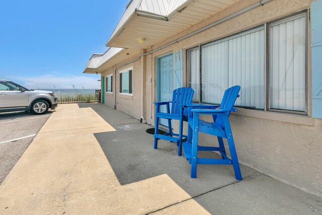 view of patio / terrace featuring fence