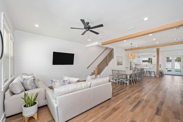 living room with hardwood / wood-style flooring and ceiling fan