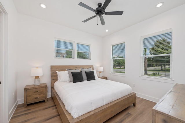 bedroom with ceiling fan and hardwood / wood-style floors