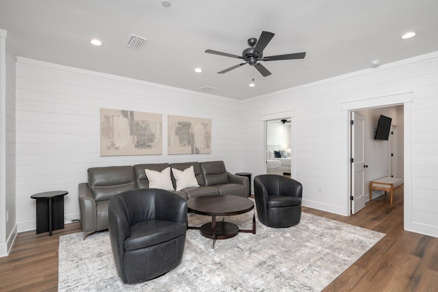 living room with ceiling fan and dark hardwood / wood-style floors