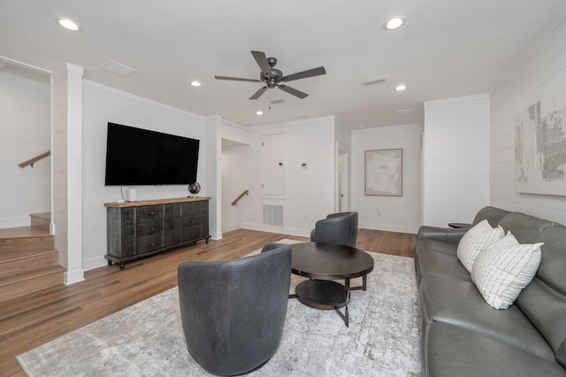 living room featuring ceiling fan and wood-type flooring