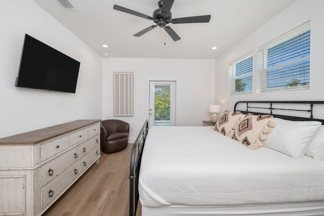 bedroom with light wood-type flooring, access to outside, and ceiling fan