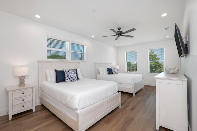 bedroom featuring ceiling fan and dark wood-type flooring