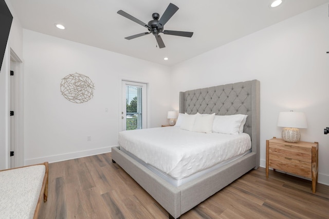 bedroom with access to exterior, ceiling fan, and wood-type flooring