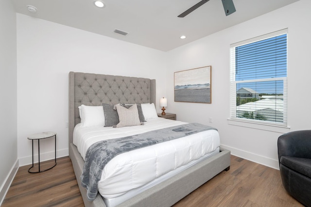 bedroom featuring dark hardwood / wood-style flooring and ceiling fan