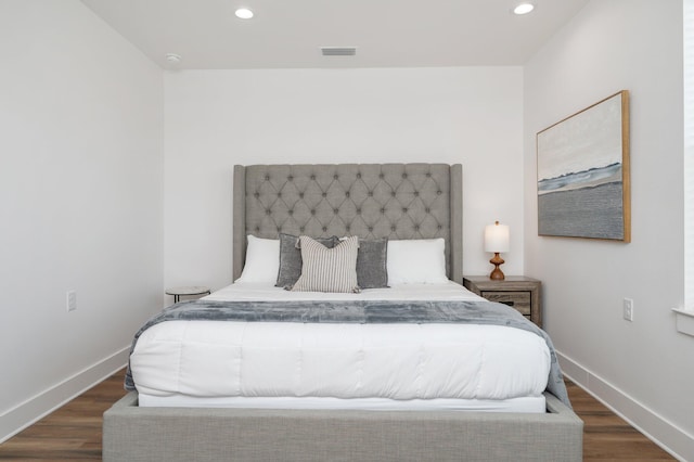 bedroom featuring dark hardwood / wood-style flooring