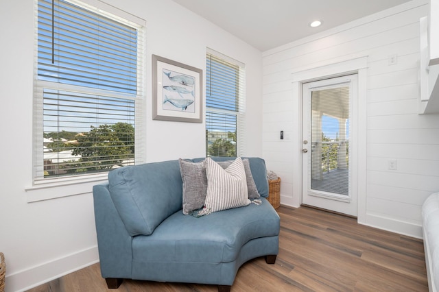 sitting room with dark wood-type flooring