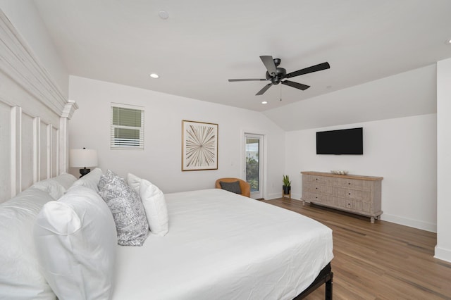 bedroom featuring ceiling fan, wood-type flooring, and lofted ceiling