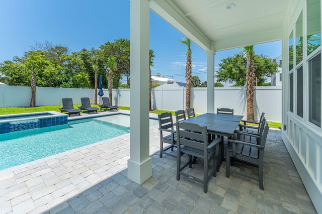 view of swimming pool with an in ground hot tub and a patio area