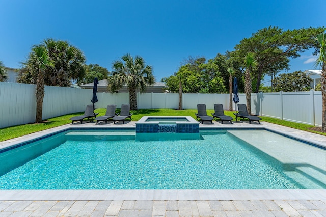 view of pool featuring an in ground hot tub