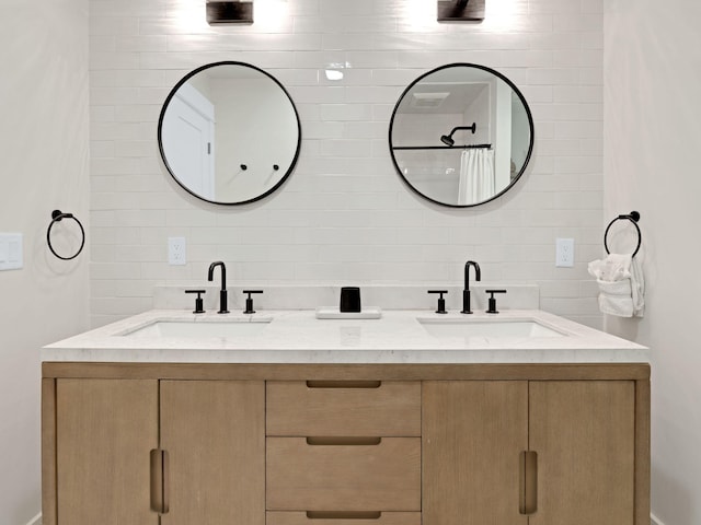 bathroom with decorative backsplash and vanity