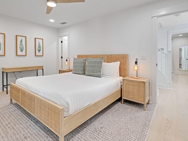 bedroom featuring ceiling fan and light hardwood / wood-style flooring