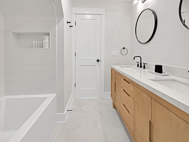 bathroom featuring tile patterned flooring and vanity