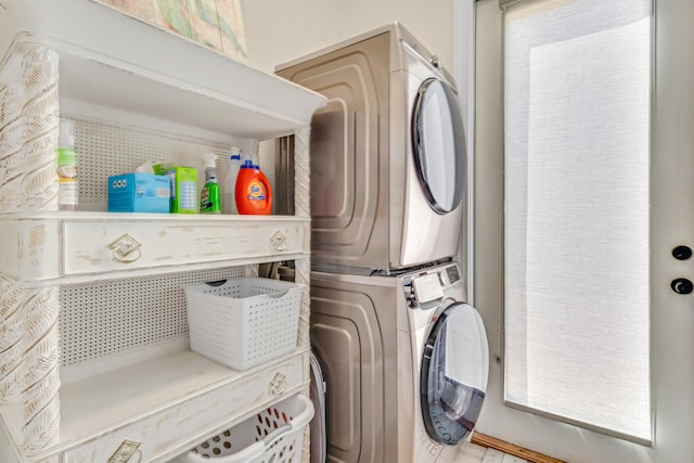 washroom with stacked washer / dryer