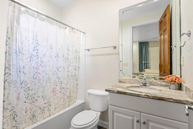 full bathroom featuring vanity, shower / bath combo, and toilet