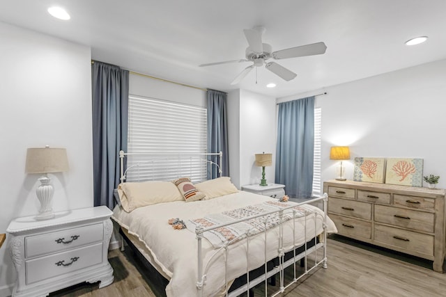 bedroom featuring ceiling fan and light wood-type flooring