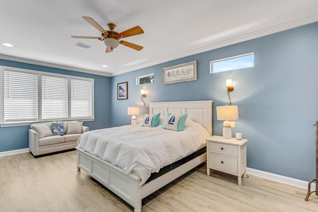 bedroom with ceiling fan, light hardwood / wood-style flooring, and crown molding