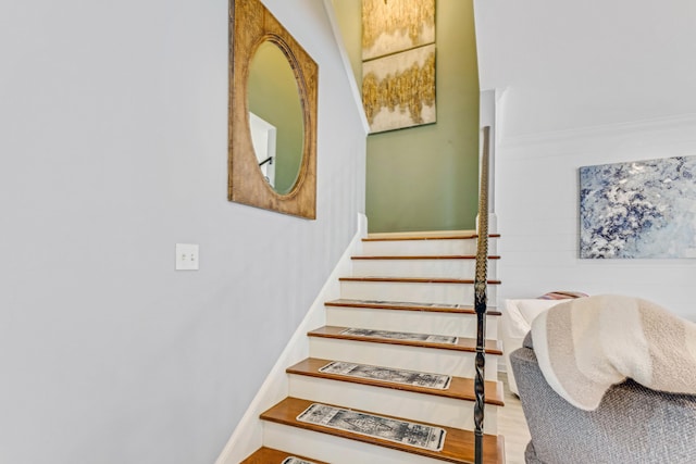 stairs featuring wood-type flooring