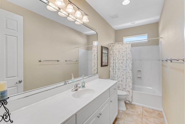 full bathroom featuring tile patterned floors, vanity, shower / bath combo, and toilet