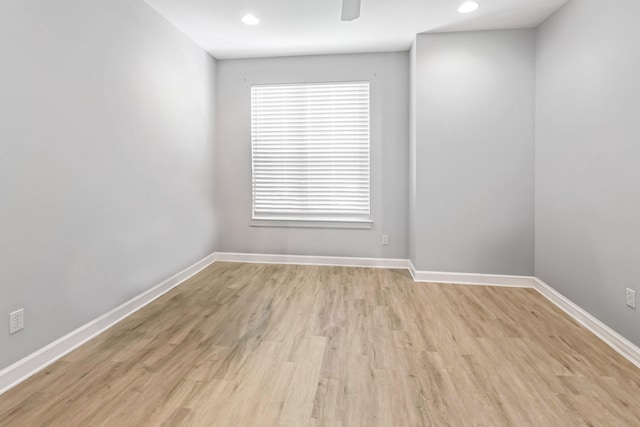 unfurnished room featuring light hardwood / wood-style flooring and ceiling fan