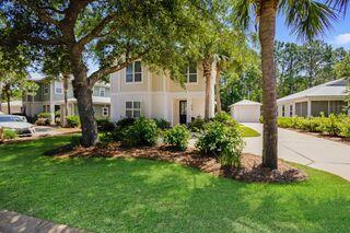 view of front of home with a front yard and a garage